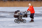 Granny ice skating with pram