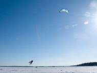 Jumping with snowboard and kite