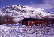 An Abiskojaure cabin with Kieron behind