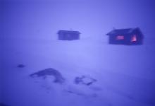 Hunddalen cabins in storm at dusk